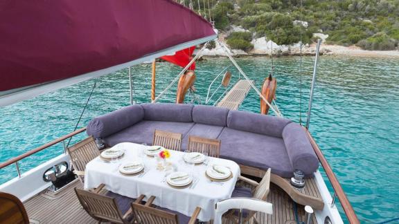 Enjoy a delicious meal with direct views of the turquoise sea aboard the Gulet Primadonna.